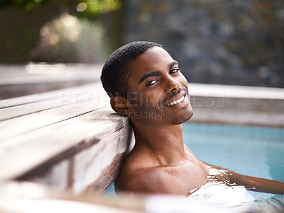 Buy stock photo Portrait, pool and water with African man smiling, vacation and holiday outdoors to relax in sunshine. Summer, swimming and happiness for body wellness, calm person and weekend entertainment