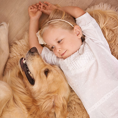 Buy stock photo Dog, child and mat on floor for animal, pet and relax together indoor for bonding, affection and friendship. Puppy, girl and smile with golden retriever for love, adorable and companion at home   