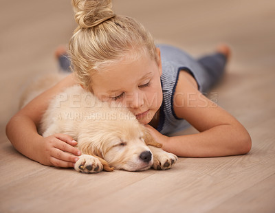 Buy stock photo An adorable little girl with her puppy  at home