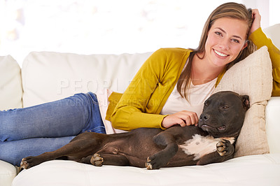 Buy stock photo Woman, dog and relax on couch in portrait, smile for pet love and bonding at home with domestic canine. Happy, positive and trust with foster or adoption, stroke puppy in living room and animal care