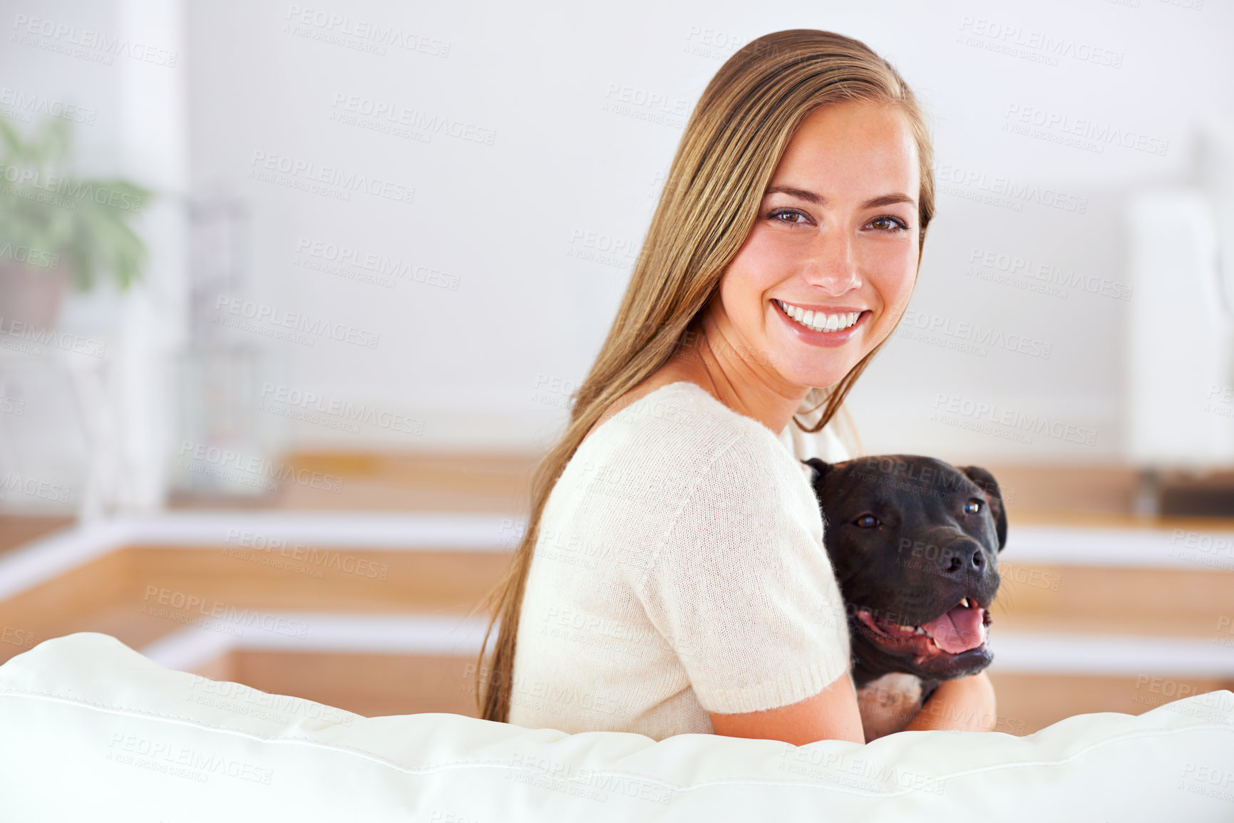 Buy stock photo Woman, portrait and smile with dog for happiness, love and relax together on couch in living room. Female person, cuddle and puppy on sofa for affection, comfort and stress relief by domestic animal