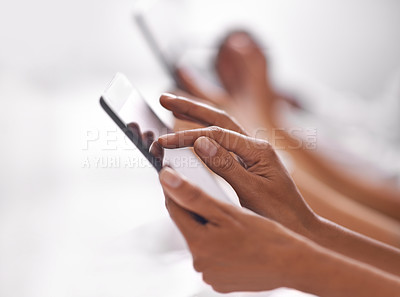 Buy stock photo Cropped shot of two people using their digital tablets
