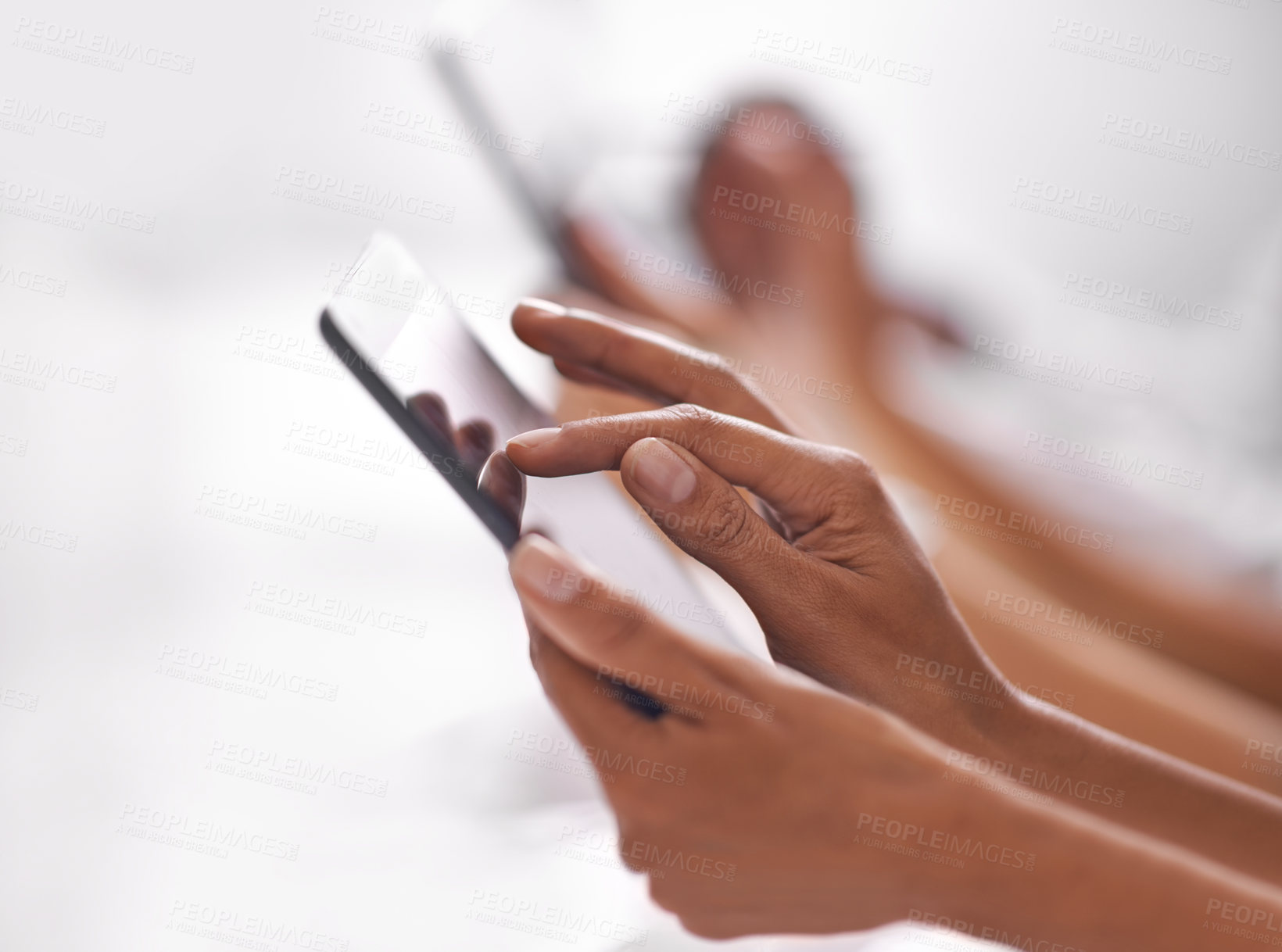 Buy stock photo Cropped shot of two people using their digital tablets