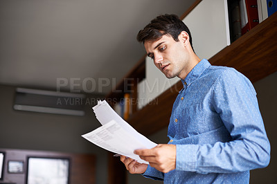Buy stock photo Reading, documents and business man in office for proposal, project review and company report. Professional, consultant and person with paperwork for information, research and planning in workplace