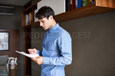Buy stock photo Reading, paperwork and business man in office for proposal, project review and company report. Professional, consultant and person with documents for information, research and planning in workplace