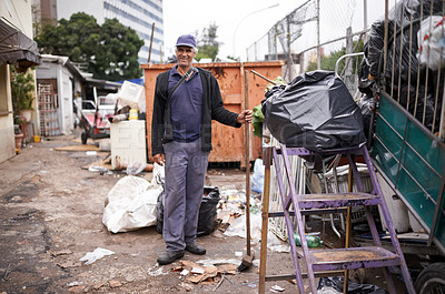 Buy stock photo Man, working and cleaning of garbage for waste management in city with portrait, broom and happiness. Person, face and smile by dumpster site for scrap, recycling and trash in neighborhood for litter