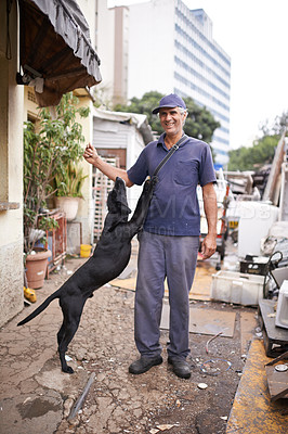 Buy stock photo Man, dog and poor poverty in street, lower class and garbage or social economy. Smile, male person and friendly pet in alley with bad infrastructure city, third world or neighbourhood and pollution