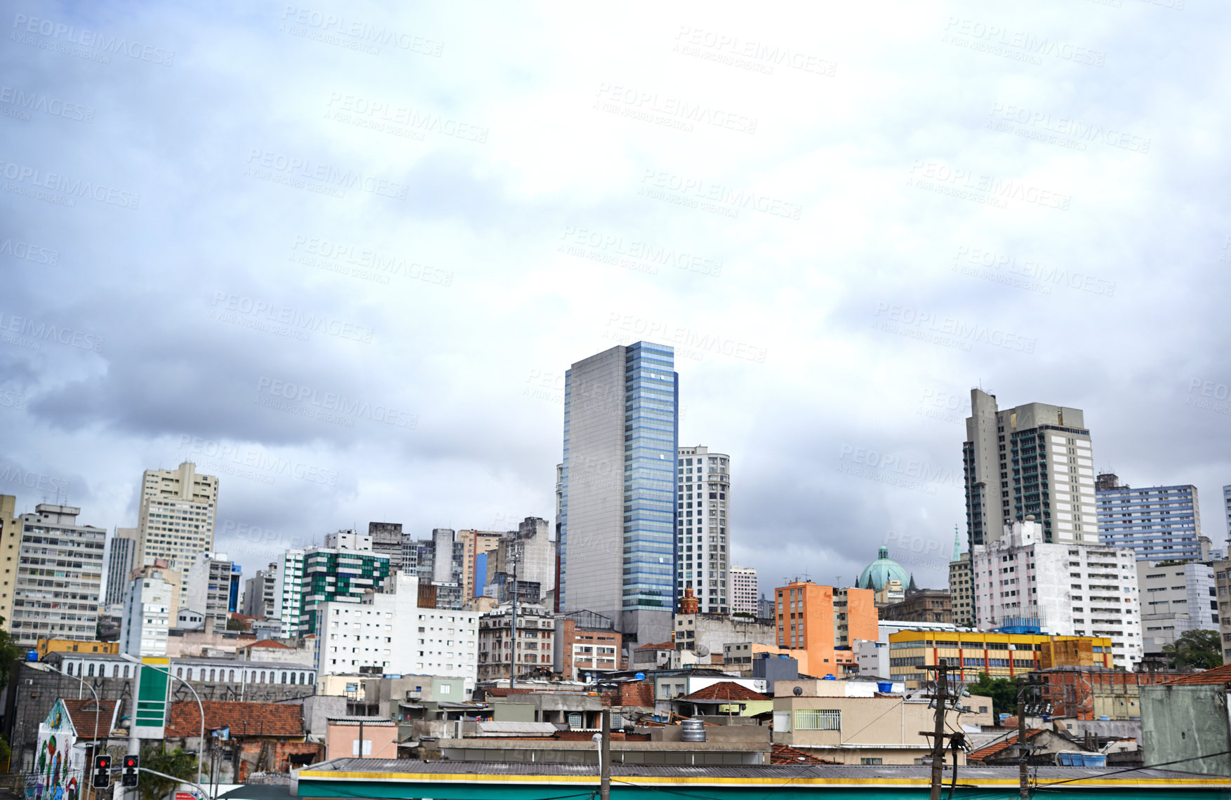 Buy stock photo Cityscape, skyline and buildings in urban architecture with development, expansion and clouds in town. City, metro and skyscraper on road, fog or winter morning on location with dark sky in Sao Paulo