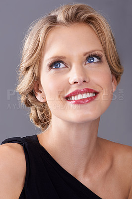 Buy stock photo Cosmetic, fashion and woman in studio with makeup face for elegant, trendy and fancy dress outfit. Beauty, hairstyle and female model with cosmetology routine and classy style by gray background.