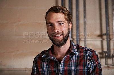 Buy stock photo Portrait, smile and happy male person in garage, workshop or industrial area for work. Face, professional and handyman or carpenter for building, design and house remodelling and trade projects 