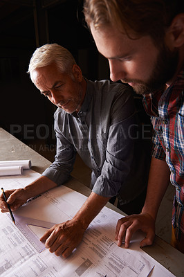 Buy stock photo Architecture, collaboration and men with blueprint in office for building, construction or repairs. Engineering, design and industrial apprentice planning and working on industry project with mentor.