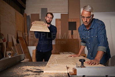 Buy stock photo Carpentry, carpenter and men in workshop work on design project with team, vocation and creative DIY skill. Teamwork, collaboration and male employee saw wood with father and son working together