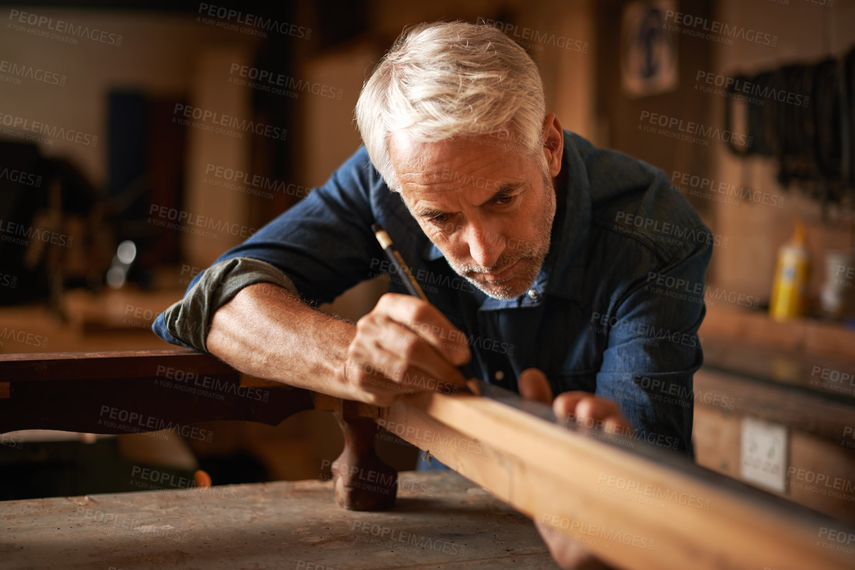 Buy stock photo Carpentry, furniture restoration and man with pencil, table and antique wood manufacturing workshop. Creativity, small business and focus, professional carpenter working on retro wood project design.