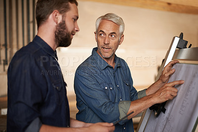 Buy stock photo Carpenter, team and men with blueprint for planning project, construction and creative. Architecture, apprentice and mentor with design, drawing and senior father with son for training at workshop