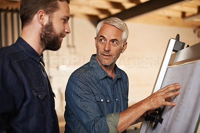 Buy stock photo Architecture, team and men with blueprint for planning project, construction or creative. Engineer, apprentice and mentor with design, drawing and senior father teaching son in discussion at workshop