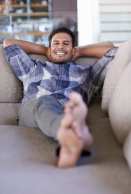 Buy stock photo Man, portrait and couch to relax in home, smile and satisfaction with lying on weekend. Happy male person, lounge and calm or comfortable in apartment, morning and confident for peace and living room