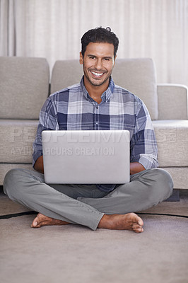 Buy stock photo Man, internet and portrait for laptop on floor of living room, education and scroll or browse on website. Male person, student and online for info or home for app, sitting and elearning or study