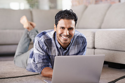 Buy stock photo Man, freelancer and portrait for laptop on floor of living room, research and scroll or browse on web. Male person, happy and online for information or home for app, remote work and internet for plan