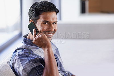 Buy stock photo Man, smartphone and relax on sofa for phone call, communication and networking in living room. Indian person, portrait and technology in apartment for conversation, discussion and mobile contact