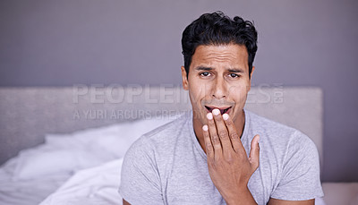 Buy stock photo Man, yawn and tired in bedroom in portrait, fatigue and insomnia with sleep problem in morning. Young person, sleepy face or exhausted on break on lazy weekend, pyjamas or stress on bed in apartment