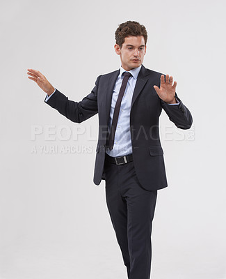 Buy stock photo Future, innovation and interface with businessman user in studio on white background for metaverse access. Corporate, digital transformation and touchscreen with young employee in suit for networking