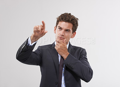 Buy stock photo Hand, thinking or businessman on touchscreen in studio on white background for metaverse access. Future, interface or software system login for finger pointing, doubt or air technology for networking