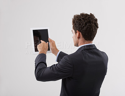 Buy stock photo Businessman, tablet and screen with studio, mockup and entrepreneur for corporate app. Man, tech and suit with employee, worker and technology from behind for future startup and career or job