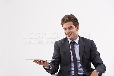 Buy stock photo Portrait, presentation and man holding a tablet, communication or digital app on white studio background. Face, person or model with technology, internet or social media with email, showing and smile