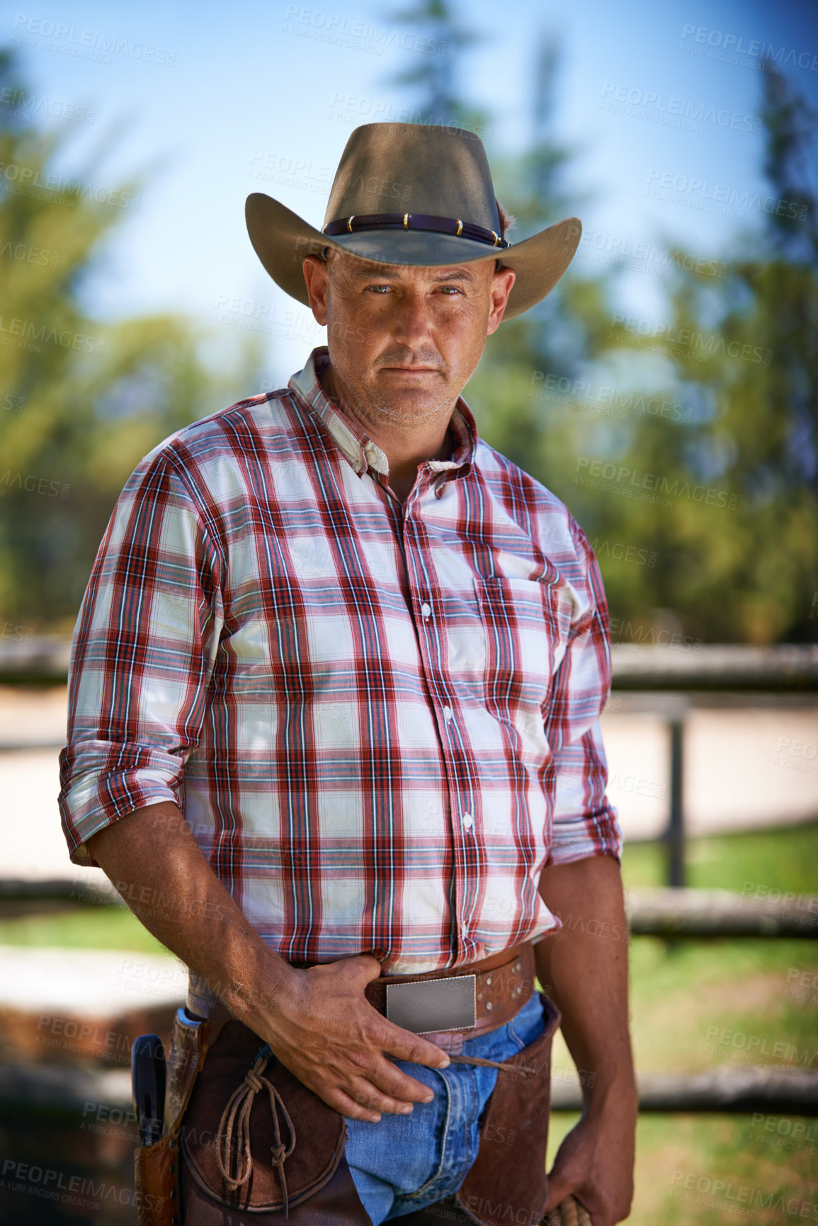 Buy stock photo Portrait, serious cowboy and man at farm in the rural countryside for agriculture in Texas. Ranch, confidence and male person in western hat outdoor in casual clothes in nature at stable on field