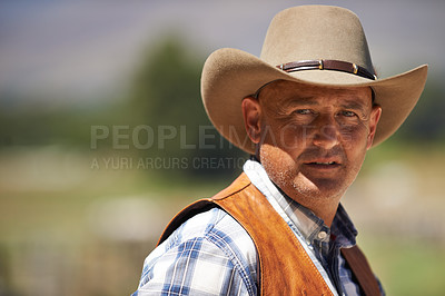 Buy stock photo Portrait, confident cowboy and man at farm in the rural countryside for agriculture in Texas. Rancher, serious and face of male person in western hat outdoor in casual clothes in nature at stable