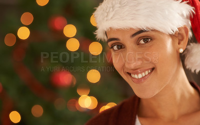 Buy stock photo Woman, Christmas tree and portrait with santa hat, happy and pride for festive fashion in home living room. Girl, person and excited for xmas celebration by lights, ornaments or smile in house party