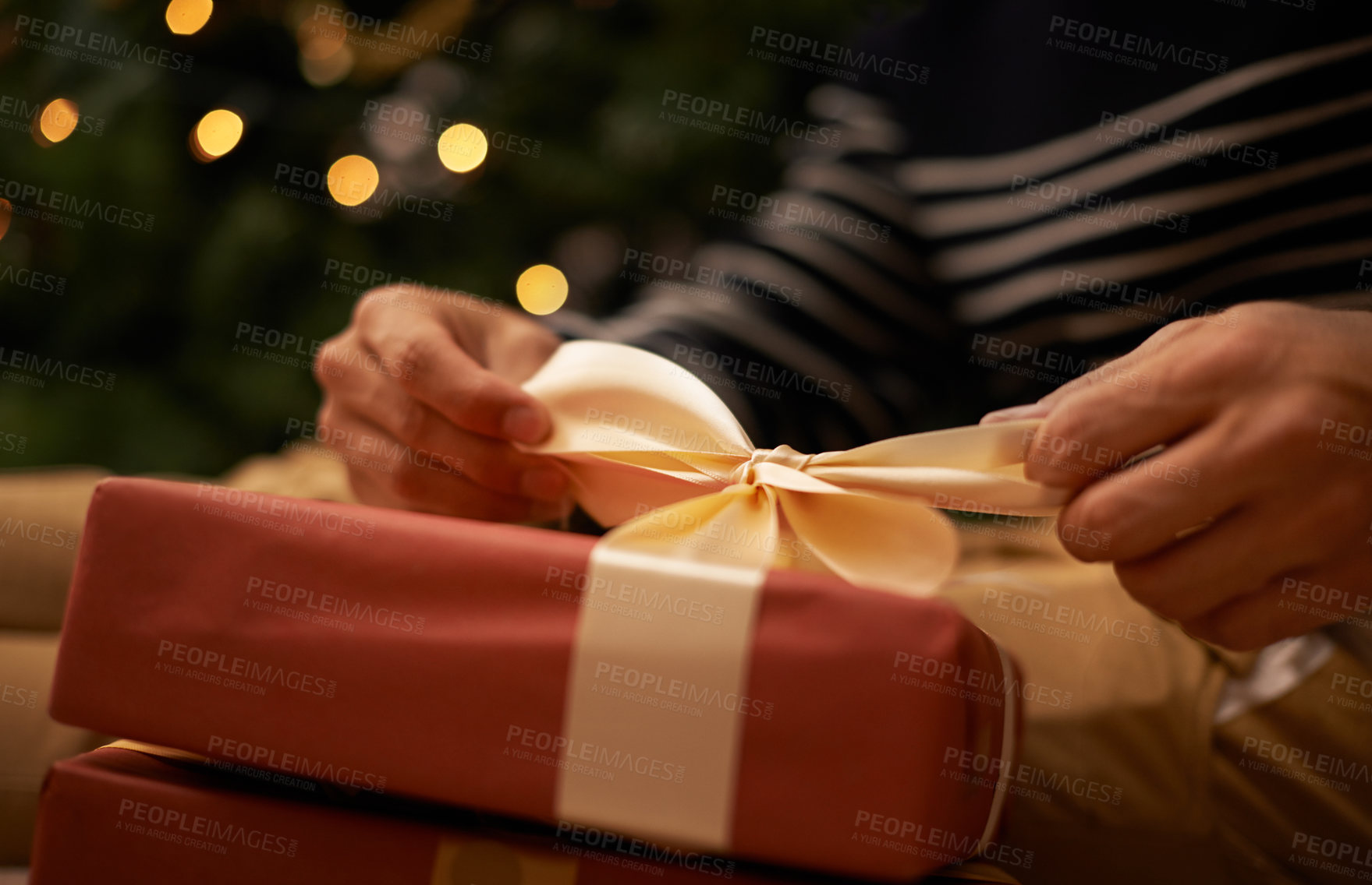 Buy stock photo Shot of a handsome young man getting ready for Christmas