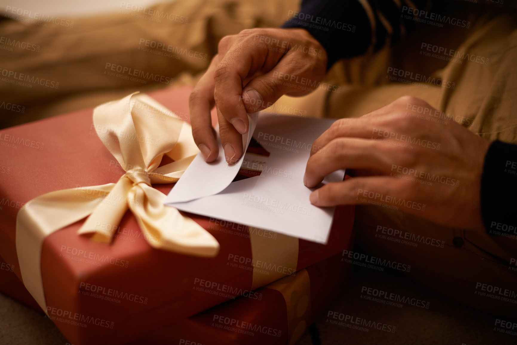 Buy stock photo Shot of a handsome young man getting ready for Christmas