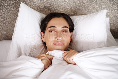 Buy stock photo Wake up, portrait and happy woman relax in bed with comfort, blanket or rest in her home from above. Sleep, face and calm female person in bedroom with morning, peace or enjoying a nap in a house