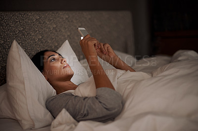 Buy stock photo Woman, scrolling and phone for social media, bed and relaxation under blankets in pajamas to sleep. Female person, browse and tech for peace, night and online for conversation, chat and memes