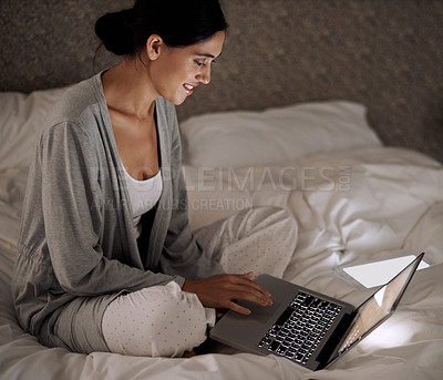 Buy stock photo Night, bedroom and woman with smile for laptop on social media, chatting and texting on site of app. Bed, female person and girl with technology for reading ebook to relax and online with internet 