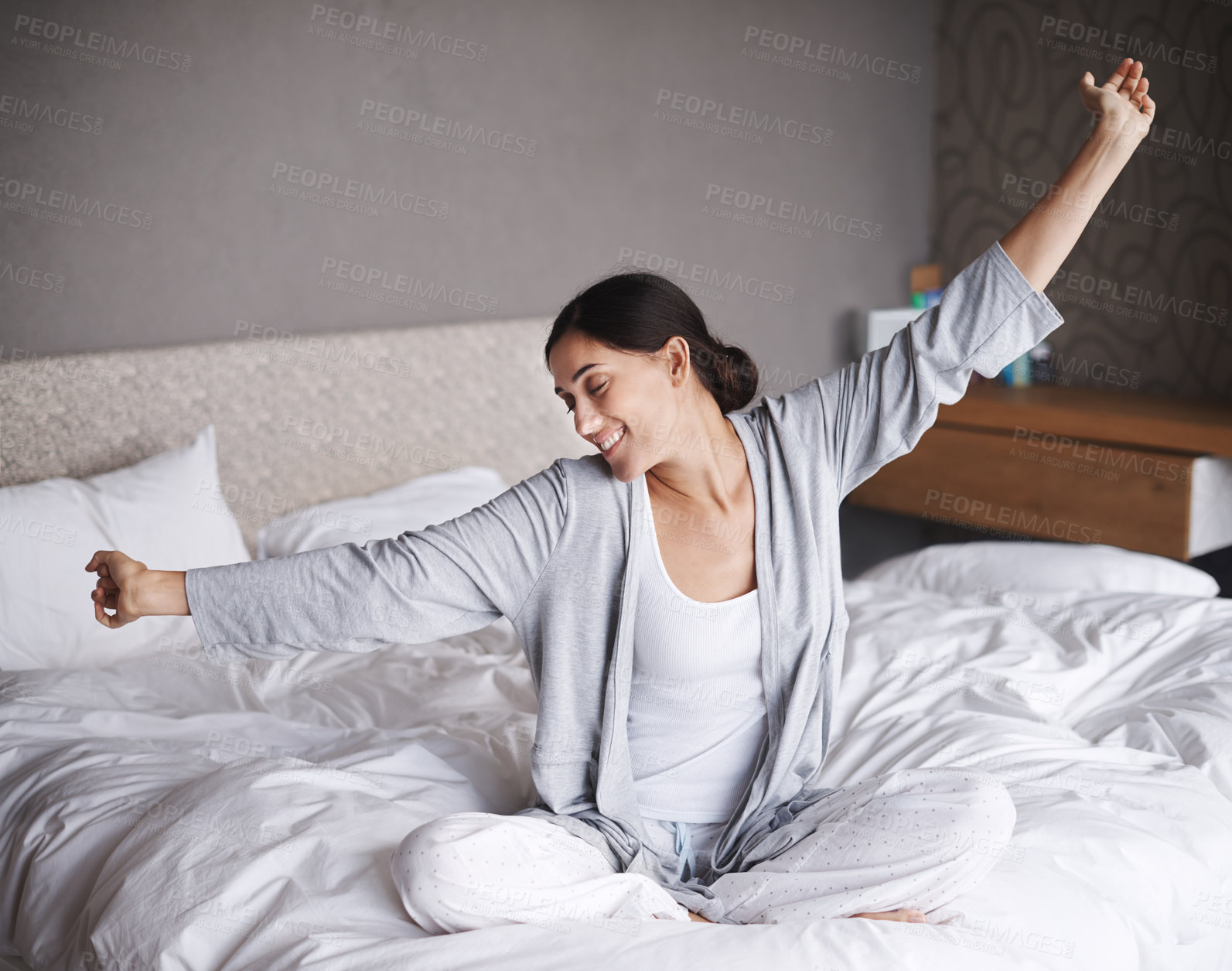 Buy stock photo Wake up, stretch and happy woman on a bed with morning, routine or body movement in her home. Relax, peace and female person stretching arms in bedroom after sleeping, resting or recovery in a house
