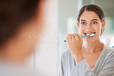 Buy stock photo Woman, brushing teeth and smile in morning by mirror for health, wellness or self care for breath in home. Girl, person and happy with toothbrush, mouth and cleaning for hygiene at apartment in Chile
