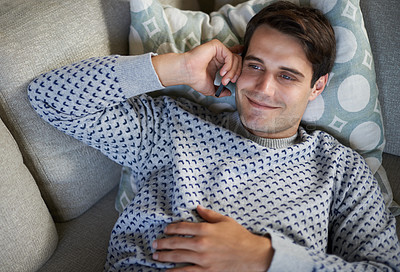 Buy stock photo Smile, phone call and top view of man in home on sofa for conversation, chat or listening to contact. Smartphone, above and happy person on couch for communication, news or relax to talk on mobile