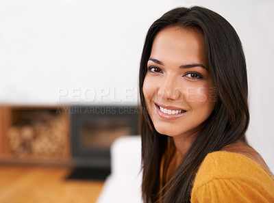 Buy stock photo Shot of a young woman relaxing on her sofa at home