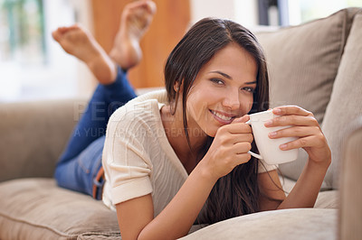 Buy stock photo Woman, coffee and portrait on sofa for relax weekend in apartment for calm holiday, peaceful or vacation. Female person, face and beverage on home couch in Mexico for morning caffeine, rest or lounge