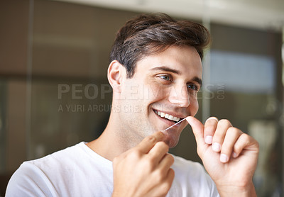 Buy stock photo Happy man, flossing and teeth with dental care for hygiene, grooming or freshness in bathroom at home. Face of handsome male person with smile in routine for oral, mouth or gum cleaning at the house