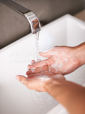 Buy stock photo Person, hands and soap with water for hygiene, cleaning or germ and bacteria removal in bathroom at home. Closeup of tap or faucet for disinfection, washing or rinsing in cleanliness by sink at house