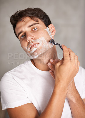 Buy stock photo Cleaning, shaving and portrait of man in bathroom for facial grooming, wellness and cosmetics at home. Health, skincare and male person shave for face hygiene, self care and hair removal with razor