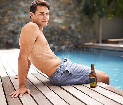 Buy stock photo Man, relax and thoughts by swimming pool at resort with beer to drink or chill on summer vacation, luxury and villa. Male person, bottle and alcohol for refreshments on tropical holiday in Maldives.
