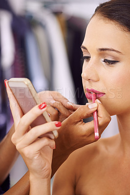 Buy stock photo Woman, makeup and phone with lipstick for beauty, cosmetics or facial treatment at home. Closeup of young female person with stylist applying color, glow or lip gloss for glamour on mobile smartphone