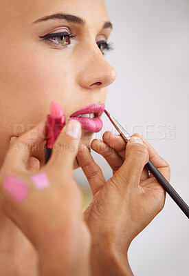 Buy stock photo Woman, lipstick and makeup artist for beauty application for professional treatment or cosmetic, product or brush. Female person, fingers and tool for mouth preparation or skincare, beautician or job