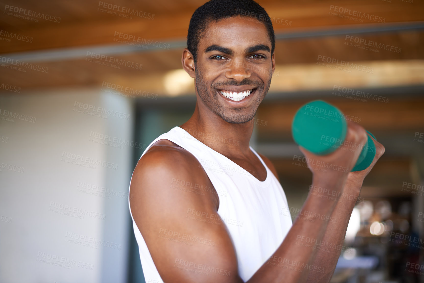 Buy stock photo Black man, smile and training with dumbbell for exercise, bodybuilding and performance goals. African person, portrait and equipment with lifting weights for wellness, strength and healthy body