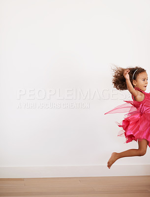Buy stock photo Girl, space or child in costume running with confidence, wellness or fairy outfit on wall background. Home, alone or excited kid with speed, youth and hair in the air for mockup, activity or jumping