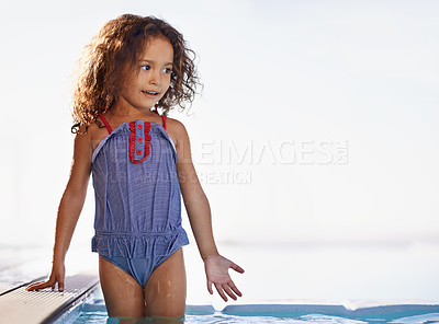 Buy stock photo Kid, girl and water with face, swimwear and blue summer sky for relax and smile. Child, youth and sunshine with happiness, outdoor and play with curly hair and fun for sunny positivity and childhood